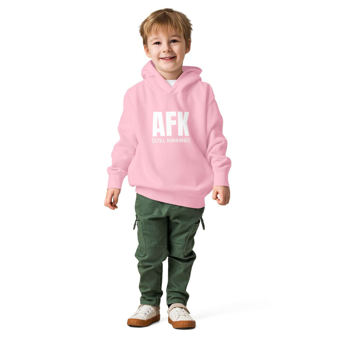 AFK Toddler fleece pullover hoodie in pink worn by a smiling boy with green pants.