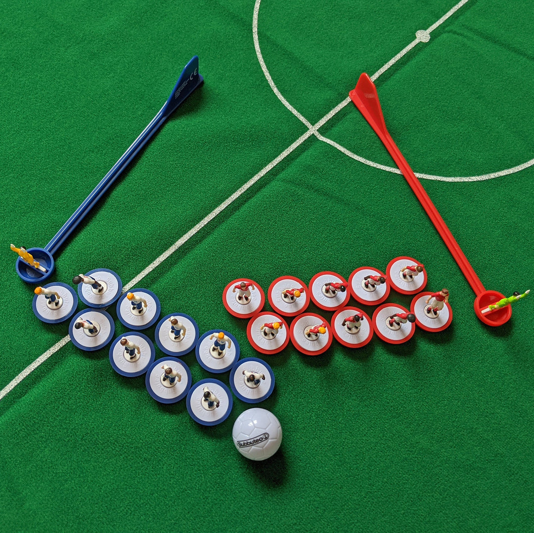 Subbuteo England Edition Main Game setup with blue and red players, perfect for football fans.